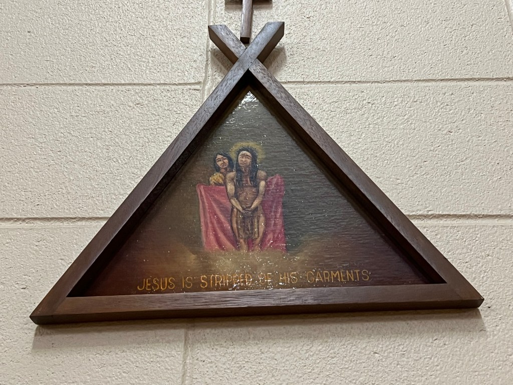 Tipi-shaped Station of the Cross depicting Jesus stripped of his garments inside Our Lady of Lourdes Catholic Church in Poplar.